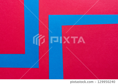 Overlapping blue and red construction paper 129950240