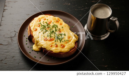Traditional welsh rarebit with a melted cheese sauce on toasted bread served with a dark ale Traditional welsh rarebit with a melted cheese sauce on toasted bread served with a dark ale 129950427