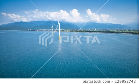 Shimoniikawa Coast in Toyama Prefecture and offshore wind turbines at the end of August 129952748