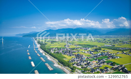 Shimoniikawa Coast in Toyama Prefecture and offshore wind turbines at the end of August 129952765