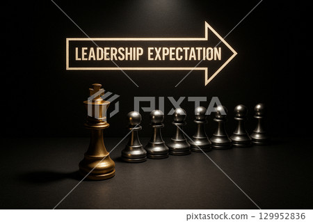 A chess pawn line with a glowing leader piece labeled leadership expectation leading the others symbolizing guidance and direction A chess pawn line with a glowing leader piece labeled leadership expectation leading the others symbolizing guidance and direction 129952836