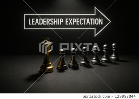 A group of chess pawns with leadership expectation text in front of a highlighted leader piece symbolizing vision and authority 129952844
