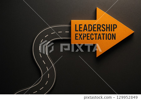 Road with a glowing orange arrow labeled leadership expectation symbolizing a journey of guidance and vision 129952849