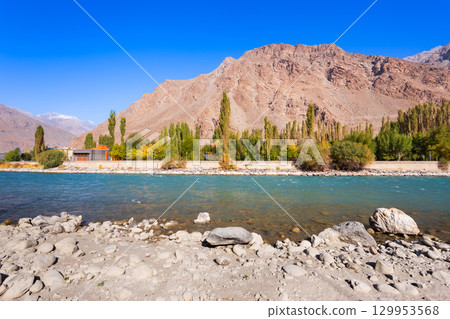 Ghunt river in Khorog city and Pamir mountains, Tajikistan 129953568