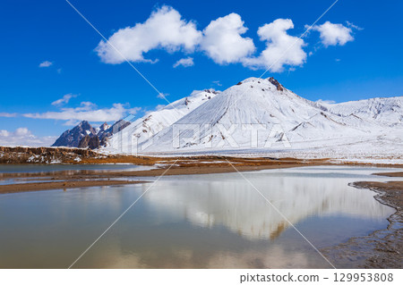 Shorkul lake and Pamir mountains near Murghab town, Tajikistan 129953808