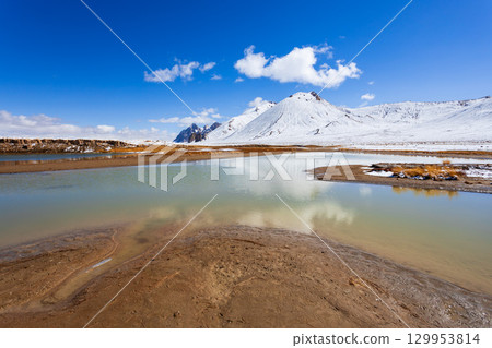 Shorkul lake and Pamir mountains near Murghab town, Tajikistan 129953814