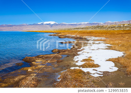 Karakul lake in the Pamir Mountains in Tajikistan 129953835