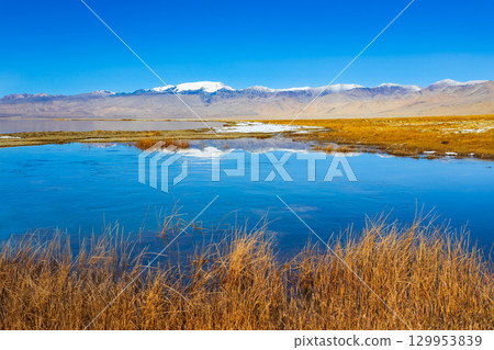 Karakul lake in the Pamir Mountains in Tajikistan Karakul lake in the Pamir Mountains in Tajikistan 129953839