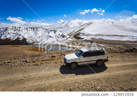 Off-road vehicle at the Pamir highway in Tajikistan Off-road vehicle at the Pamir highway in Tajikistan 129953916