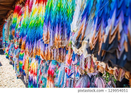 Colorful thousand paper cranes offered at a shrine in Kyoto 129954051