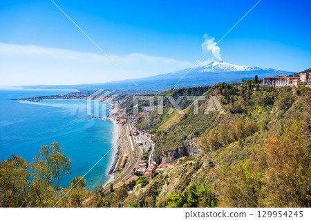 Taormina city, Etna volcano aerial panoramic view, Sicily Taormina city, Etna volcano aerial panoramic view, Sicily 129954245