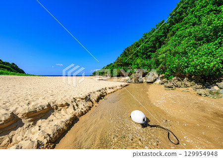 A spectacular summer view of Ishigaki Island's Crystal Beach, a white sand beach with a stream running through it 129954948