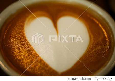 Cups of coffee decorated with a heart 129955246