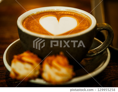 Cups of coffee decorated with a heart Cups of coffee decorated with a heart 129955258