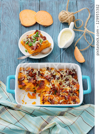 sweet potato casserole with bacon, cheese, onion sweet potato casserole with bacon, cheese, onion 129955382
