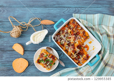 sweet potato casserole with bacon, cheese, onion 129955385