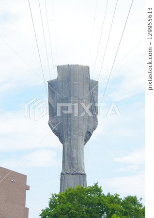 Covered power line tower 129955613