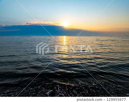 Aerial view sunset sky,Nature beautiful Light Sunset or sunrise over sea,Colorful dramatic sunset Sky, Amazing clouds and waves in sunrise sky golden light cloud background Aerial view sunset sky,Nature beautiful Light Sunset or sunrise over sea,Colorful dramatic sunset Sky, Amazing clouds and waves in sunrise sky golden light cloud background 129955677