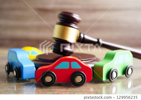 Car accident lawsuit and insurance, Judge hammer with car model. 129956235
