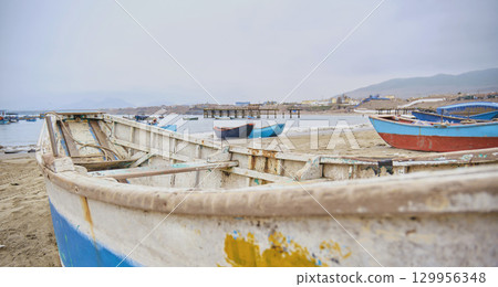 A boat on it is sitting on the beach A boat on it is sitting on the beach 129956348