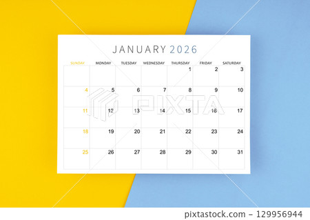 January 2026 calendar page on yellow and blue color background. January 2026 calendar page on yellow and blue color background. 129956944
