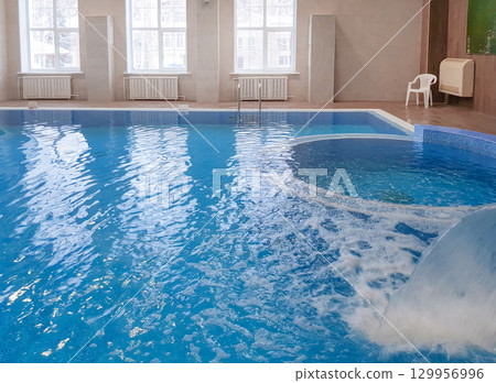 Modern luxury indoor pool, year-round resort and hotel concept 129956996
