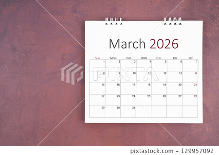 March 2026 desk calendar on red cement wall background. Page of annual monthly calendar for plan. 129957092