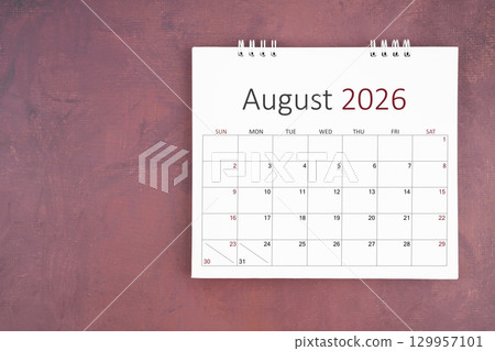 August 2026 desk calendar on red cement wall background. Page of annual monthly calendar for plan. August 2026 desk calendar on red cement wall background. Page of annual monthly calendar for plan. 129957101