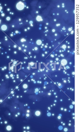 Soft glowing blue bokeh lights scattered across a deep blue background, creating a dreamy night atmosphere Soft glowing blue bokeh lights scattered across a deep blue background, creating a dreamy night atmosphere 129957352