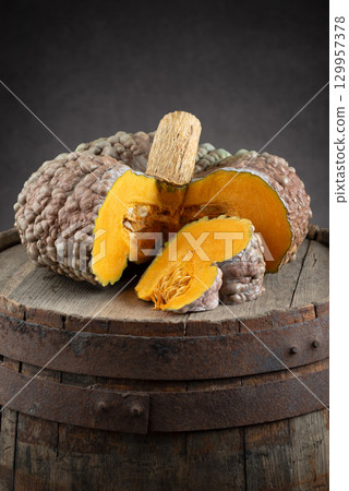 Cut Marina Di Chioggia Pumpkin On Rustic Wooden Barrel Cut Marina Di Chioggia Pumpkin On Rustic Wooden Barrel 129957378