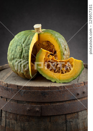 Crespo Squash Pumpkin With Slice On Wooden Barrel Crespo Squash Pumpkin With Slice On Wooden Barrel 129957381