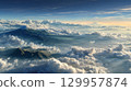 Majestic mountain peaks above clouds at sunrise. Neural network AI generated 129957874