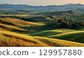 Lush rolling hills under golden sunlight in serene valley. Neural network AI generated 129957880