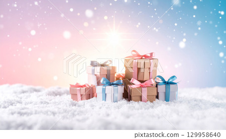 Small gift boxes and shining lights lined up in the snow 129958640