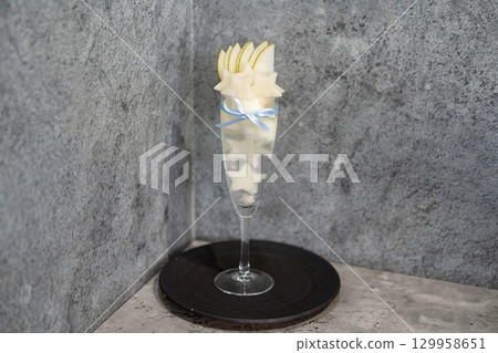 A luxurious parfait with star-shaped pears A luxurious parfait with star-shaped pears 129958651