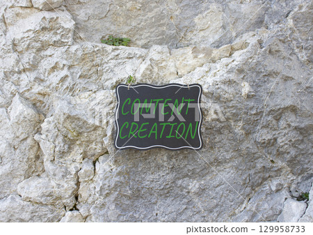 Content creation symbol. Stone wall with words Content creation. Beautiful stone background. Business and Content creation concept. Copy space. Content creation symbol. Stone wall with words Content creation. Beautiful stone background. Business and Content creation concept. Copy space. 129958733