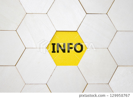 Info symbol. Concept word Info on wooden comb puzzle. Beautiful yellow background. Business and Info concept. Copy space. 129958767