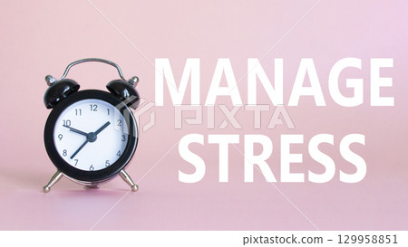 Manage stress symbol. Concept word Manage stress on Beautiful pink background with alarm clock. Medicine and Manage stress concept. Copy space 129958851