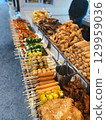 Thai street food stall with assorted grilled meat, vegetables, spring rolls and sausages. Concept of culture, tradition, lifestyle and authentic cuisine. 129959036