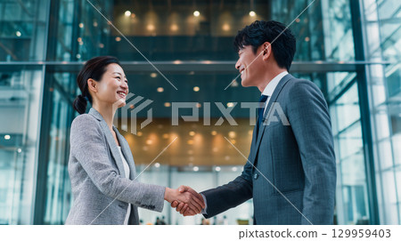 Business partnership handshake 129959403