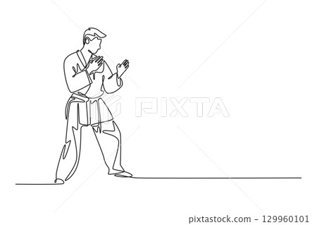 Single one line drawing active man in karate uniform is in ready stance. Symbolizing poised discipline, mental focus, and preparation for fight. Continuous line draw design graphic vector illustration 129960101