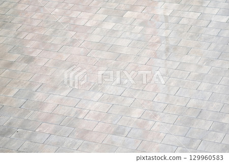 texture of the stone paving slabs in the form of square tiles 129960583