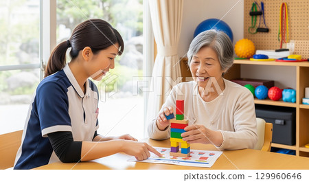 Seniors undergoing rehabilitation through occupational therapy 129960646