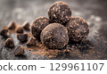 Dark chocolate truffles on slate 129961107