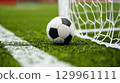 Soccer ball by the goal line 129961111