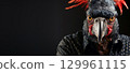 Exotic bird with a vivid plumage as a human-like person. 129961115