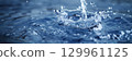 Water splash in serene blue tones 129961125