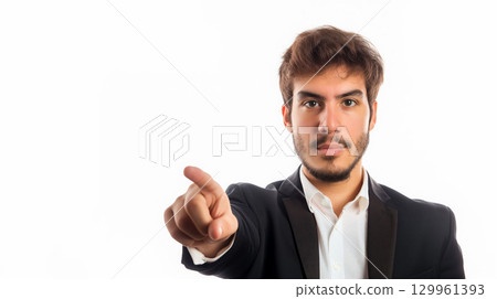 Businessman pointing confidently forward. 129961393