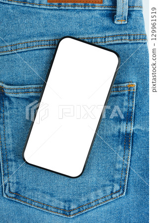 Mockup of modern smartphone with blank screen sticking out of blue denim jeans back pocket close up 129961519