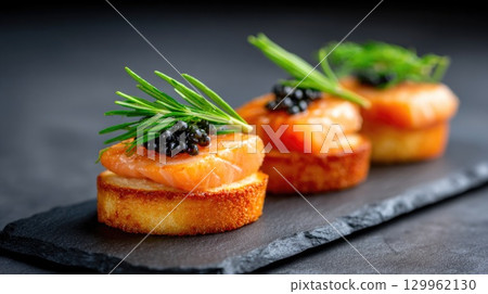 Gourmet salmon and caviar appetizer on slate 129962130